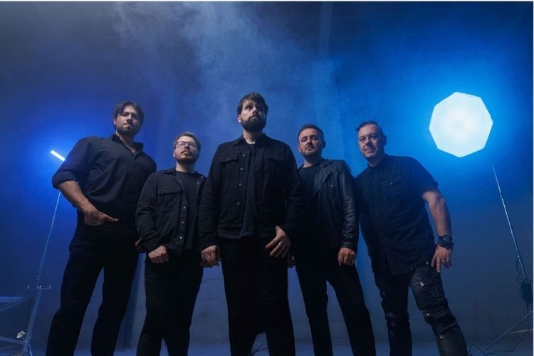 Absent Theory lit from behind in blue haze